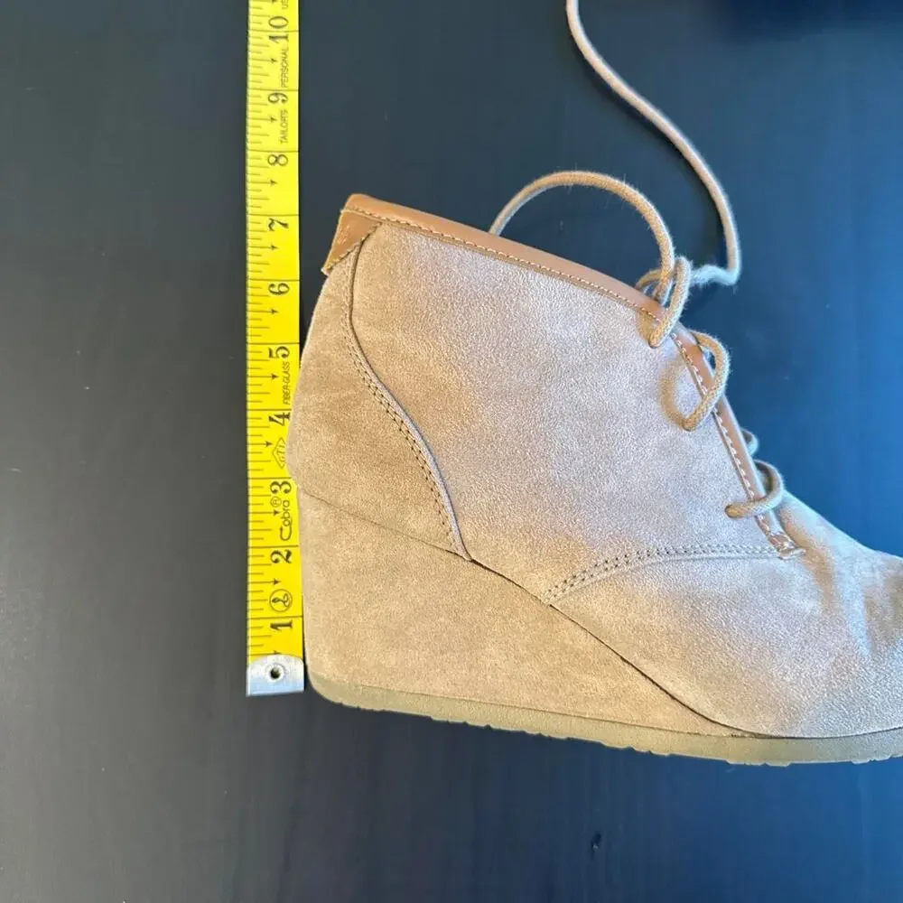 Tan suede ankle boots with lace-up design and chunky sole